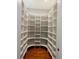 Spacious walk-in pantry with custom shelving and beautiful hardwood floors at 4101 Brookview Se Dr, Atlanta, GA 30339