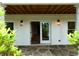 Covered back patio with flagstone, wood ceiling, brick walls, and contemporary lighting at 4101 Brookview Se Dr, Atlanta, GA 30339