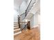 Classic wooden staircase featuring dark iron spindles and wooden handrails and hardwood floors at 4101 Brookview Se Dr, Atlanta, GA 30339