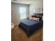 This cozy bedroom has a comfortable queen-sized bed and a large window at 4829 Station Lane -Lot 30, Union City, GA 30349
