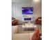 Cozy living room with a modern fireplace, plush seating and television at 4829 Station Lane -Lot 30, Union City, GA 30349