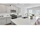 Contemporary kitchen with stainless steel appliances, quartz counters, and ample cabinet space at 605 Vidalia Pkwy, Mcdonough, GA 30252