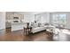 Bright living space with hardwood floors, modern furniture, and access to the kitchen at 605 Vidalia Pkwy, Mcdonough, GA 30252