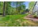 Spacious backyard featuring a well-maintained lawn, an outdoor seating area, and beautiful landscaping at 1186 Thomas Rd, Decatur, GA 30030
