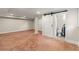 The large basement has a bathroom and a sliding barn door, offering versatile living space at 1186 Thomas Rd, Decatur, GA 30030