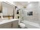 Modern bathroom showcasing sleek tile work, glass shower, and updated fixtures at 1186 Thomas Rd, Decatur, GA 30030