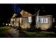 Charming home with attractive exterior lighting, new landscaping, and a welcoming entrance at night at 1186 Thomas Rd, Decatur, GA 30030