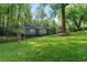 Charming home with a sprawling green lawn and mature trees, providing a picturesque and serene setting at 1186 Thomas Rd, Decatur, GA 30030