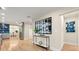 Spacious hallway leading to kitchen, showcasing hardwood floors and modern decor at 1186 Thomas Rd, Decatur, GA 30030