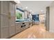 Modern kitchen featuring stainless steel appliances, gray cabinets, and an open layout, perfect for entertaining at 1186 Thomas Rd, Decatur, GA 30030