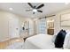 Main bedroom with ensuite, hardwood floors, recessed lighting and seating bench at 1186 Thomas Rd, Decatur, GA 30030
