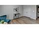 Bedroom with a wooden console table, beach themed wall art, and double door closet at 3677 Sorrel Ln, Duluth, GA 30096