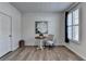 Cozy bedroom with wood-look floors, white walls, and plantation shutters, perfect for a relaxing retreat at 3677 Sorrel Ln, Duluth, GA 30096