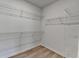 Walk-in closet with wood floor and wire shelving to maximize storage space at 3677 Sorrel Ln, Duluth, GA 30096