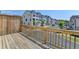Exterior deck with wood railing, privacy screen, and neighborhood street view at 3677 Sorrel Ln, Duluth, GA 30096