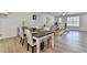 Dining room featuring dining table and chairs in open concept living space at 3677 Sorrel Ln, Duluth, GA 30096