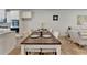 Dining table and chairs located between the kitchen and living spaces at 3677 Sorrel Ln, Duluth, GA 30096