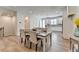 Open dining area with wood floors flows into kitchen, creating an inviting space at 3677 Sorrel Ln, Duluth, GA 30096
