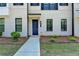 Attractive townhome showcasing a welcoming entryway, well-manicured landscaping, and a modern design at 3677 Sorrel Ln, Duluth, GA 30096