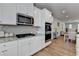 Open-concept kitchen with white cabinets, stainless steel appliances, and granite countertops, great for entertaining at 3677 Sorrel Ln, Duluth, GA 30096