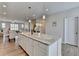 Bright kitchen with an island boasting granite countertop and open floor plan at 3677 Sorrel Ln, Duluth, GA 30096