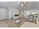 Open concept living area with a modern fireplace and kitchen at 3677 Sorrel Ln, Duluth, GA 30096