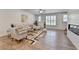Open living room with plenty of natural light, fireplace and modern decor at 3677 Sorrel Ln, Duluth, GA 30096