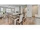Open living space with dining area, modern fireplace, and comfortable seating providing a great flow at 3677 Sorrel Ln, Duluth, GA 30096