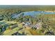 Aerial view of a community, showcasing a golf course, clubhouse, pool, and surrounding greenery at 8083 Cypress Ct, Villa Rica, GA 30180