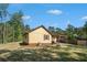 A view of the house from the tree-filled backyard at 8083 Cypress Ct, Villa Rica, GA 30180