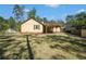 A view of the house from the tree-filled backyard at 8083 Cypress Ct, Villa Rica, GA 30180