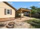 Wooden pergola and gas fire pit in the spacious backyard at 8083 Cypress Ct, Villa Rica, GA 30180