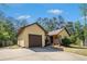 Well-maintained ranch-style home featuring a charming facade, attached garage, and green lawn at 8083 Cypress Ct, Villa Rica, GA 30180
