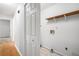 Hallway leading to laundry room with a shelf at 8083 Cypress Ct, Villa Rica, GA 30180