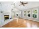 Spacious living room features wood floors, fireplace, and windows overlooking the yard at 8083 Cypress Ct, Villa Rica, GA 30180