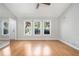 Living room boasting hardwood flooring, ample natural light, and neutral paint at 8083 Cypress Ct, Villa Rica, GA 30180