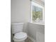 Close up of a toilet in a bright bathroom at 8083 Cypress Ct, Villa Rica, GA 30180