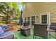 Inviting back deck with outdoor seating, a fire pit, and green turf for relaxation and entertainment at 3215 Rose Petal Ln, Powder Springs, GA 30127