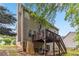 Exterior view of the back of the house, highlighting the raised wooden deck with staircase at 3215 Rose Petal Ln, Powder Springs, GA 30127