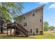 Back exterior view of the home, showing deck with stairs and siding at 3215 Rose Petal Ln, Powder Springs, GA 30127
