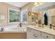 Bright bathroom with a soaking tub, double vanity and generous counter space at 3215 Rose Petal Ln, Powder Springs, GA 30127