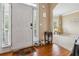 Bright foyer with hardwood floors, leading to a cozy living space at 3215 Rose Petal Ln, Powder Springs, GA 30127