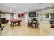 Entertainment space with a pool table, bar area, TV, and comfortable seating for socializing at 3215 Rose Petal Ln, Powder Springs, GA 30127