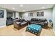 Comfortable living room with hardwood floors, leather couches, and decorative accents at 3215 Rose Petal Ln, Powder Springs, GA 30127