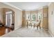 Inviting living room featuring neutral walls, carpet, and bay windows for natural light at 3215 Rose Petal Ln, Powder Springs, GA 30127