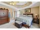 Spacious main bedroom features a ceiling fan, tray ceiling, and comfortable furnishings at 3215 Rose Petal Ln, Powder Springs, GA 30127