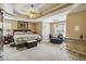 Large main bedroom with a tray ceiling, ceiling fan and lots of natural light at 3215 Rose Petal Ln, Powder Springs, GA 30127