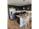 An inviting kitchen with granite countertops, stainless steel appliances, and a functional center island with seating at 4827 Station Lane -Lot 31, Union City, GA 30349