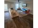 A well-lit living room featuring a comfortable sofa, modern decor, and hardwood floors at 4827 Station Lane -Lot 31, Union City, GA 30349