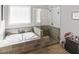 This bathroom features a tub, separate shower, and tiled surround at 1976 Boyd Trace Nw Ln, Atlanta, GA 30318